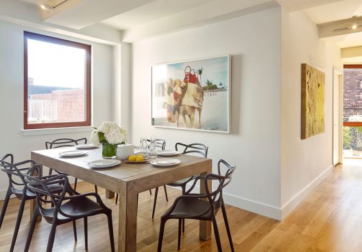 The units' finishes emphasize light: white oak floors, 9-foot ceilings, and optimally placed windows with movable shutters.