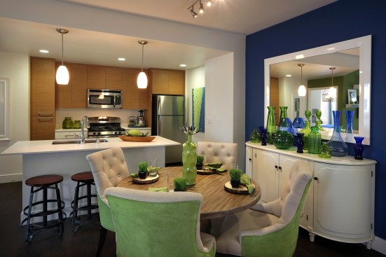 Units reflect typical open-plan living and range from studios to three-bedrooms, suitable for various generations.