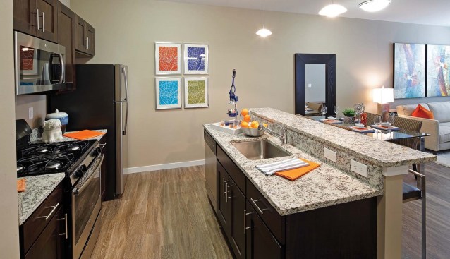 Finishes in the building's residential kitchens include granite countertops, stainless steel appliances, in-unit washers and dryers, and designer lighting.