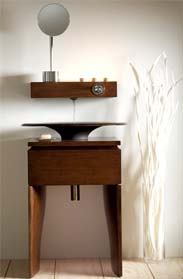 Kohler Co.'s newest collection of bathroom products, Fountainhead, is a departure from the traditional geometric shapes of contemporary design. The collection includes furniture vanities and mirrored cabinet components with ambient technology. Fountainhead is available in two finishes: a lightly grained maple and a richly grained ash featuring a dark truffle stain. 