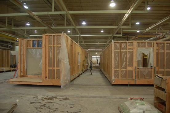 Modular buildings are constructed off site under controlled plant conditions, then shipped to the site for assembly, reducing the construction schedule.