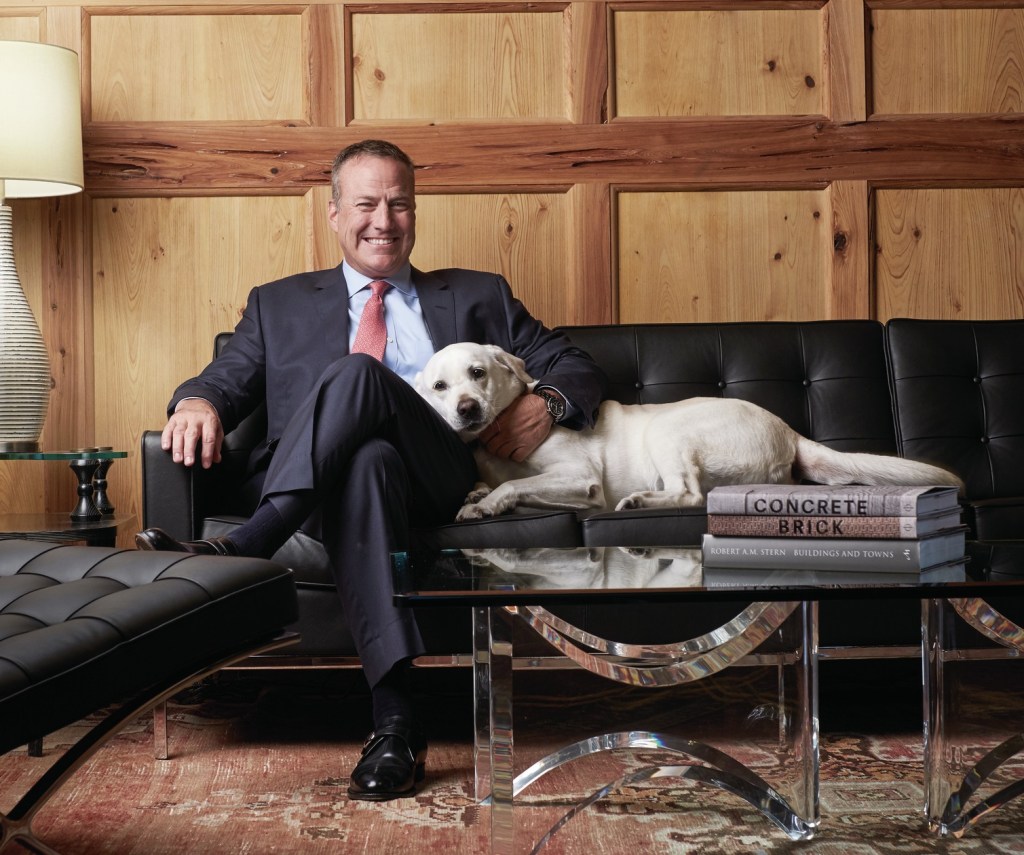 Corporate companion: Among his many down-to-earth qualities, Bob Faith brings his dog, Dakota, to work every day, a cuddly fixture at corporate headquarters.
