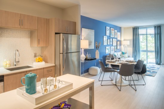 The residential units at m.flats seem bigger than they are due to their open plans, floor-to-ceiling windows, and restful palette choices.