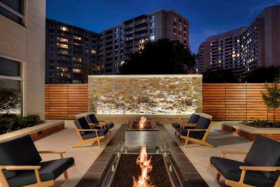 outdoor fireplace, fountain, courtyard, amenities, mid-rise