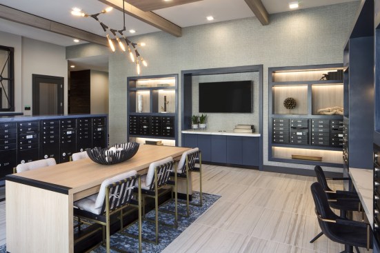 Opposed to a traditional mailroom, Kilby in Frisco, Texas, boasts a modern design with seating areas.