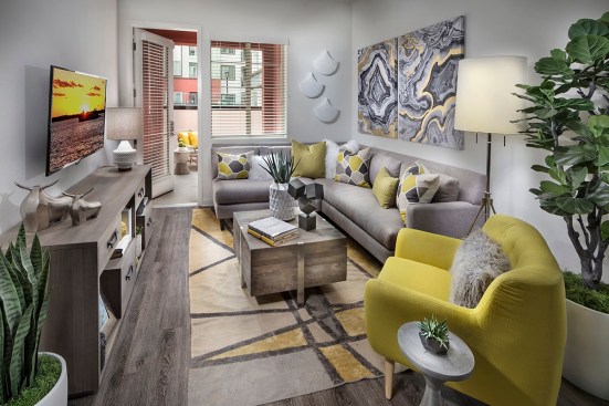 This unit's living room opens to a balcony at Metro Gateway, appealing to the popular desire among renters to bring a little of the outdoors in.