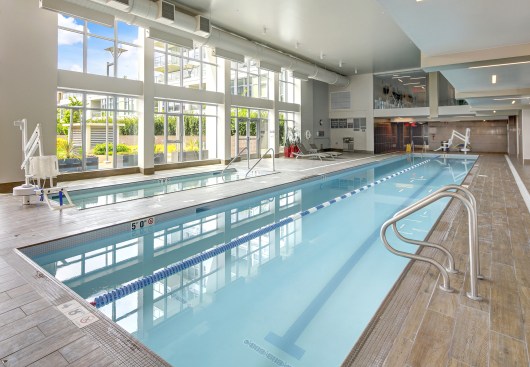 View of indoor swimming pool in luxurious apartment building. Northwest, USA