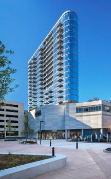 The building with residences at NewCity is faced with a curved, metal-and-glass façade for optimal views.
