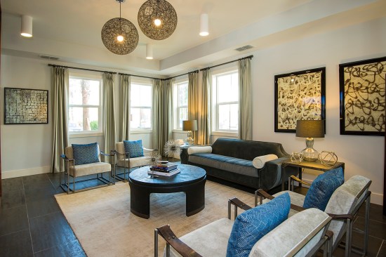 Community amenities at Parkside at The Highlands include a comfortable resident lounge and club room.