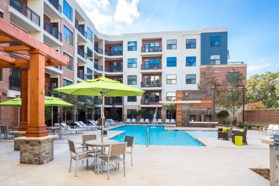 Amenities at The Place on Ponce include this resort-style pool, complete with tanning ledge.