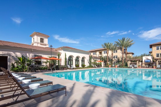 The design of Portola Court in Irvine, Calif., accommodates zoning restrictions stipulating that the project's two-story buildings surround its three-story buildings to mitigate the multifamily development's impact.