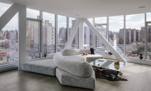 The residential units on 100 Norfolk's upper levels feature exposed structural trusses.