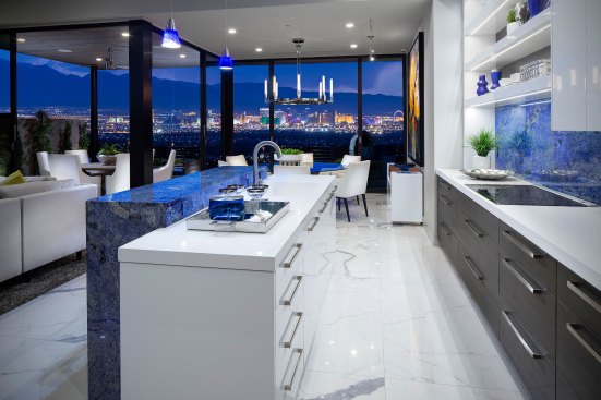 Because the ability to entertain was key, kitchens were designed to have functional parts concealed as much as possible, as well as open shelves, luxurious choices in tiles and countertops, and lots of lighting to work, set a mood, and provide overall illumination. “We wanted it to resemble more of a hotel-style lounge with people congregating to cook or eat,” says Bill Ramsey of KTGY Architecture + Planning.