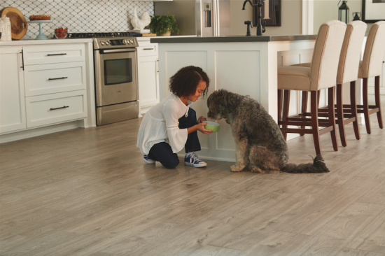 Mohawk’s new Revwood Plus flooring is a 100% waterproof laminate flooring with a wood look that the company describes as somewhere between hardwood and vinyl.