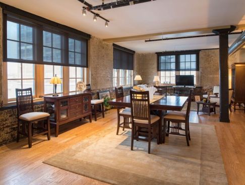 A clubroom at 500 Seneca hints at the building's warehouse, turn-of-the-20th-century past, with its exposed-brick walls and Craftsman decor.