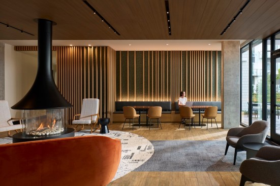 At Canopy Apartments, modern fireplaces and wood accents from Ankrom Moisan create relaxing atmospheres full of warmth.