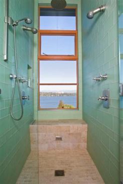 Sited on the edge of a cliff, this renovated mid-century home allows its owners to take in the view from multiple vantage points – even when they’re in the shower. As part of the remodel, Prentiss Architecture moved the master suite from the basement to higher ground. It now sits on top of the roof of the original house. 
Architect: Prentiss Architects, Seattle 
Builder: Schultz Miller, Seattle