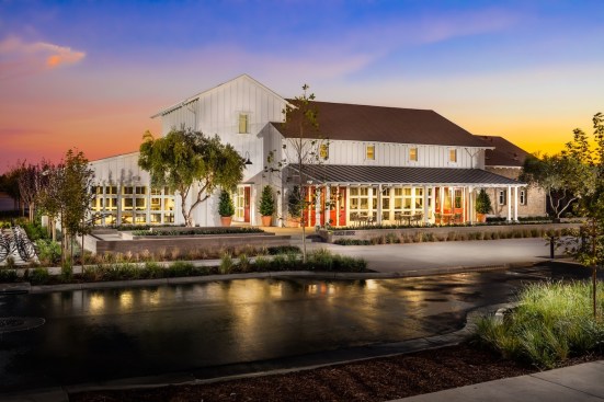The Ranch House recreation center is the heart of The Cannery community. Designed by Robert Hidey Architects, the building's exterior reflects the agrarian area's farming roots.