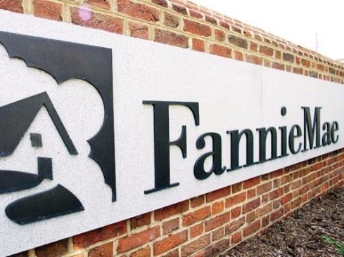 FILE- In this July 11, 2008 file photo, a sign in front of the Fannie Mae headquarters in Washington is seen. Seized by federal regulators 14 months ago, the problems at Fannie Mae and sibling company Freddie Mac have proven far worse than most experts had foreseen. Fannie Mae's request Thursday, Nov. 5, 2009, will bring the tab for rescuing both companies to about $111 billion. The government has promised up to $400 billion in assistance. (AP Photo/Manuel Balce Ceneta, File)