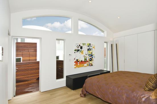 Slice of Heaven Stepped back upper-story massing gives master bedrooms direct access to private outdoor decks.