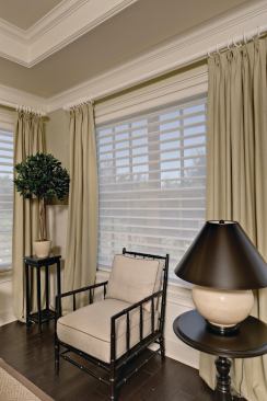Blind Ambition With all the openings in the house, there is a need for sun protection as well as privacy. Hunter Douglas blinds and shutters provide both. NewStyle shutters in the great room, den, and second bedroom control light, while Silhouette Window Shadings in the master bedroom permit light but maintain privacy. www.hunterdouglas.com .