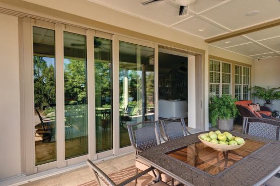 Wide Openings Providing visual and physical access to the lanai and backyard grill is an impressive 16-foot-wide installation of WinDoor's 8000 series sliding glass panels. Each panel has a depth of 1 3/4 inches with 4 5/8-inch stiles and rails. Specified with low-E glass, the doors glide on a stainless steel system that stacks the 10-foot-tall panels to the side. www.windoorinc.com.