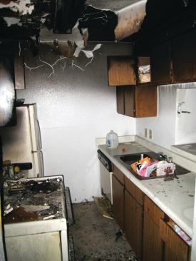 A dilapidated kitchen in the original Hollyview Apartments, before the complex was rehabilitated by Tom Miller