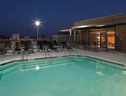 HIGH DESIGN: In 2011, Behringer Harvard showed its real estate prowess by winning a merit award in the High-Rise Project of the Year, Apartment, category in Multifamily Executive’s MFE Design Awards program. The winning property was The Cameron, in Silver Spring, Md. (pool area shown).