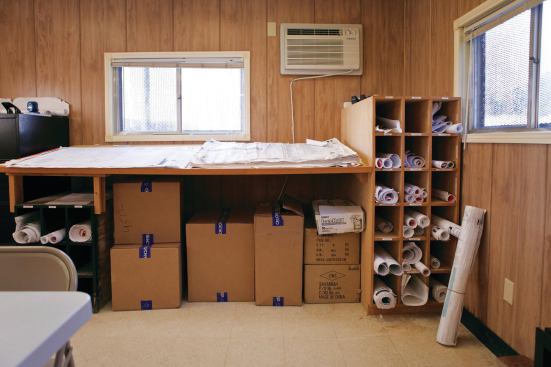 Stored in the business trailer, blueprints and plans are constantly being consulted and revised. 