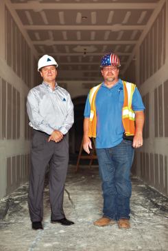 Padgett (left) and Born check on the progress on an upper floor in Zone 3.
