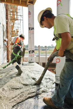 Subs lay the concrete for a balcony floor facing downtown Atlanta. 