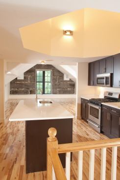 A cupola admits abundant natural light in a top-floor residence at 50 St. Peter in Salem, Mass. 