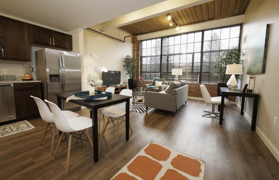 Synthetic wood flooring replaces the original floorboards at Voke Lofts. The sustainably made product contains mostly recycled material.
