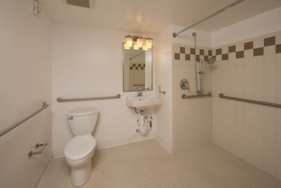 Bathrooms received a facelift with new tile tub surrounds, flooring, vanities, and low-flow toilets.
