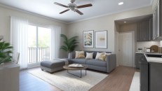 Studio apartment interior with a cozy living area, featuring a small loveseat, coffee table, and compact storage units.